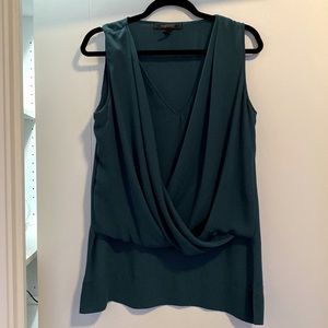 BCBG Maxazria blouse, good condition, 100% polyester. Size M.